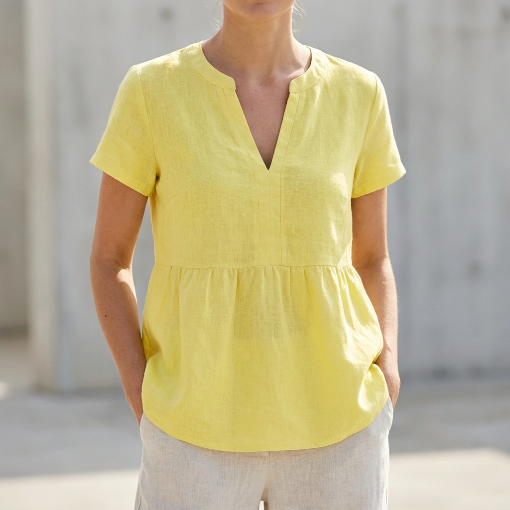 V-Neck Peplum Blouse with Pintuck Detailing and Curved Hem